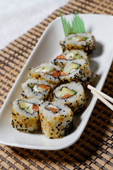 Sushi is traditionally made with medium-grain white rice. It is very often prepared with seafood, such as squid, eel, yellowtail, salmon, tuna or imitation crab meat.