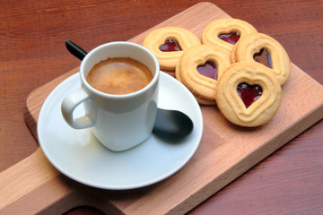 coffee and biscuits on wooden surface
