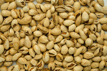 tasty nutritious shell almonds on a white background