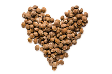 delicious nutritious fried apricot pits with salt, in the form of heart
