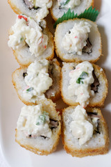 Sushi is traditionally made with medium-grain white rice. It is very often prepared with seafood, such as squid, eel, yellowtail, salmon, tuna or imitation crab meat.