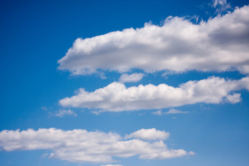White clouds in the blue sky. Ozone Layer. Blue background
