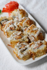 Sushi is traditionally made with medium-grain white rice. It is very often prepared with seafood, such as squid, eel, yellowtail, salmon, tuna or imitation crab meat.