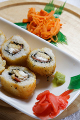 Sushi is traditionally made with medium-grain white rice. It is very often prepared with seafood, such as squid, eel, yellowtail, salmon, tuna or imitation crab meat.