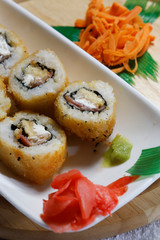 Sushi is traditionally made with medium-grain white rice. It is very often prepared with seafood, such as squid, eel, yellowtail, salmon, tuna or imitation crab meat.