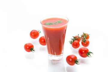 homemade tomato juice in a glass and fresh tomatoes