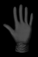 Fototapeta premium black glove on black background / abstract photo background image