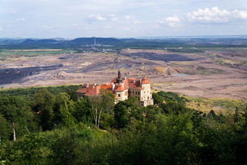 Jezeri Castle with Czechoslovak army coal mine in background, Horni Jiretin, Most district, Ustecky region, Czech Republic, sunny summer day
