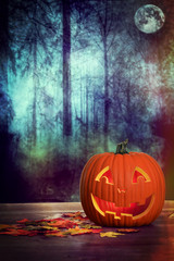 halloween pumpkin in spooky forest scene