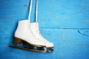 women figure ice skates hanging 