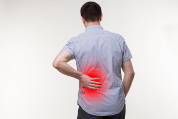 Back pain, kidney inflammation, man suffering from backache