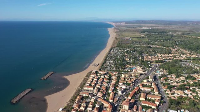 Beach coastline aerial view Valras Plage residential houses seaside resort France sunny