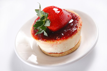 Cheese pie with strawberries and walnut.