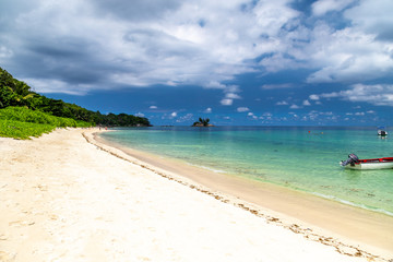 Paradise beach anse royale on Seychelles island Mahé with turguoise water, palms, white sand and granite rocks