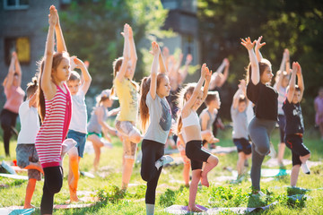Yoga classes outside on the open air. Kids Yoga,