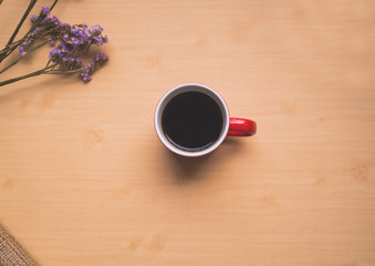 Red coffee mug placed on the center.