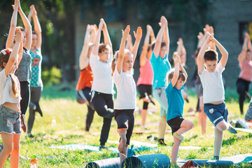 Yoga classes outside on the open air. Kids Yoga,