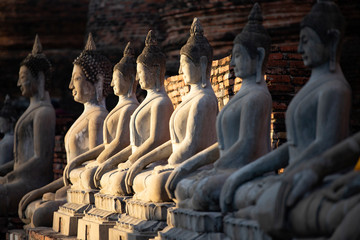 Sitting buddha statues at Wat Yai Chai Mongkhon temple in Ayutthaya, Thailand