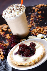 Lemon pie with puff pastry and blackberry.