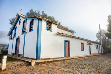 Historic church in foggy city in Tiradentes, Minas Gerais, Brazil. Fog in historic center.