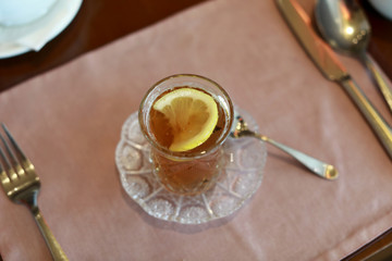 Armud glass with tea and lemon