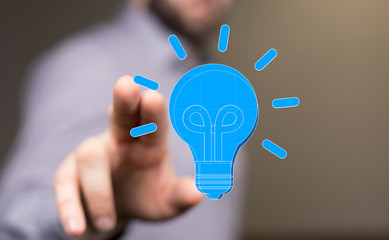  holding illuminated light bulb, idea, innovation and inspiration concept.