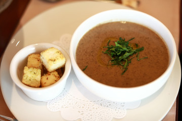 Bowl with mushroom soup puree