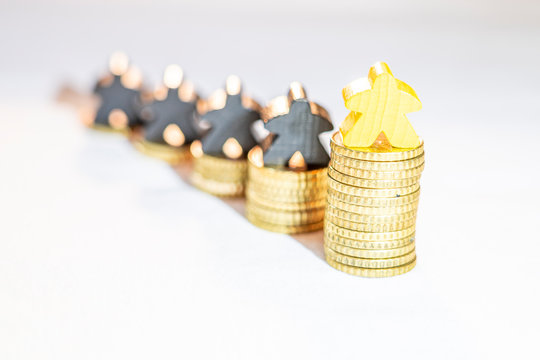 illustration of growth with piles of ten cent coins and wooden meeples on white background