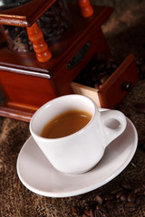 Coffee with grains and sweet bread. Coffee is a brewed drink prepared from roasted coffee beans, the seeds of berries from certain Coffea species.
