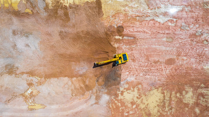 Aerial view excavator working on a construction site. © Kalyakan