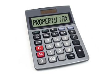 Calculator isolated with property tax on white background