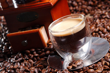 Espresso is coffee of Italian origin, brewed by expressing a small amount of nearly boiling water under pressure through finely ground coffee beans and has crema on top.