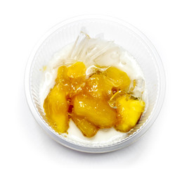 Thai food dessert : Sweet cassava  in syrup with coconut milk and ice.