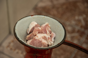 Meat grinder - process of grinding meat. Beef mince in mincing-machine. Cooking food
