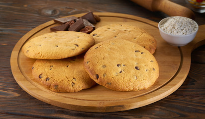 Homemade cookies with nuts on a dark wooden background,