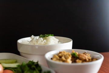 Thai cuisine, Northern of Thailand Lanna style, Hot steamed rice with crispy belly pork in chili flavor and fresh vegetables, Space for text