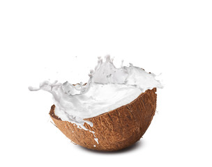 Cracked coconut with  splashes isolated on white backround