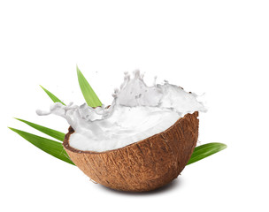 Cracked coconut with  splashes isolated on white backround