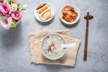 A bowl of shiitake mushroom lean porridge and sour cabbage sour radish