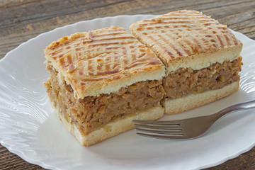 Apple pie two slices of cake on plate at wooden table