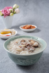 A bowl of shiitake mushroom lean porridge and sour cabbage sour radish