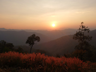 Fototapeta na wymiar Beautiful Sunset over the mountains in Thailand