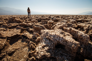 A hiker in Death Valley National Park, Geology, sand.