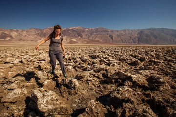 A hiker in Death Valley National Park, Geology, sand.