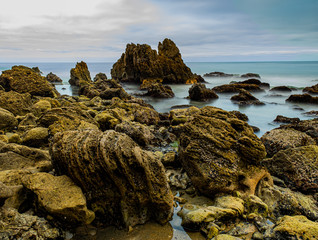 Nice morning walk at Corona Del Mar State Beach CA USA with nice stones formation