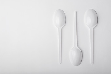 Three plastic spoon on white background.