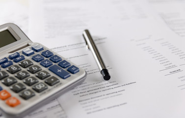 Calculator and pen Placed on accounting