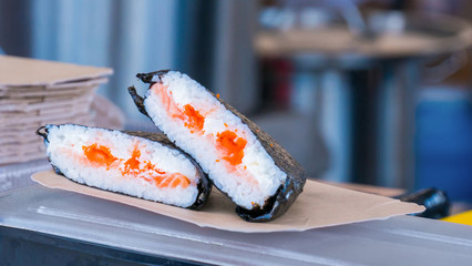 Outdoor cooking, gastronomy, asian food and service concept - Japanese sushi rolls at russian street food market festival
