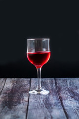 Pink wine. Wine in a glass near fruits and grapes. Traditional Georgian wine according to ancient technology. Copy space Close up and vertical orientation.