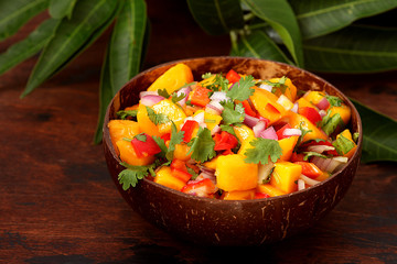 Salsa with mango, onion, hot pepper and cilantro